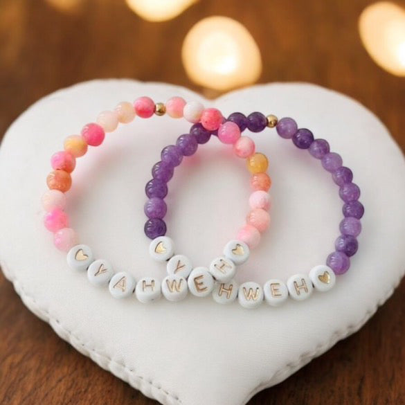 Pink and purple marble bead bracelets with white letter beads and gold accents
