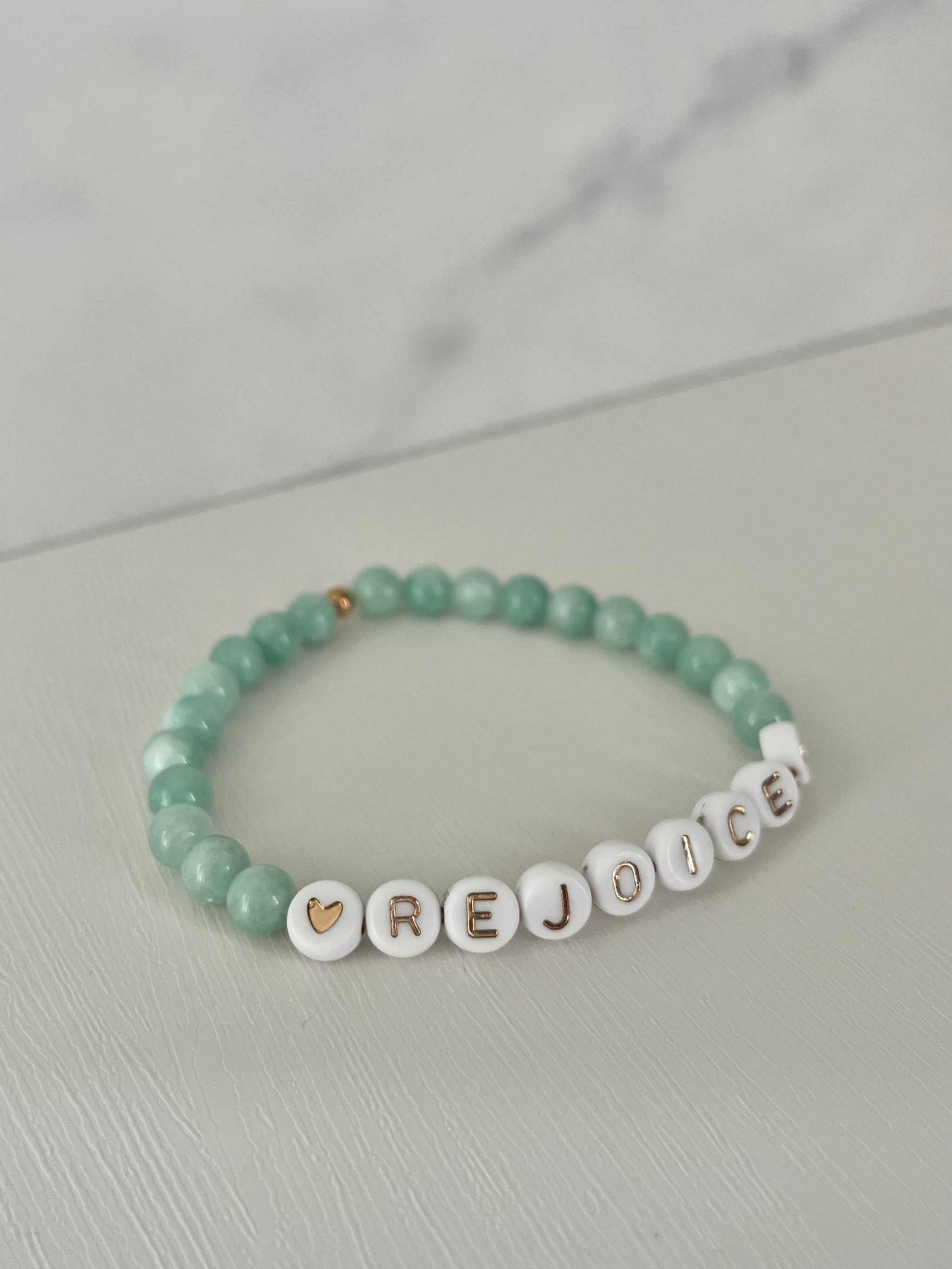 Green jade bead bracelet, REJOICE on white round letter beads