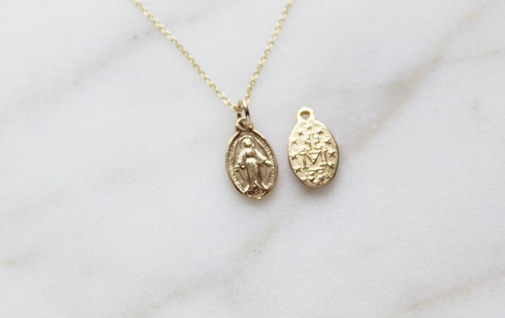 14k gold miraculous medal necklace with oval medal pendant on a fine chain