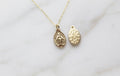 14k gold miraculous medal necklace with oval medal pendant on a fine chain