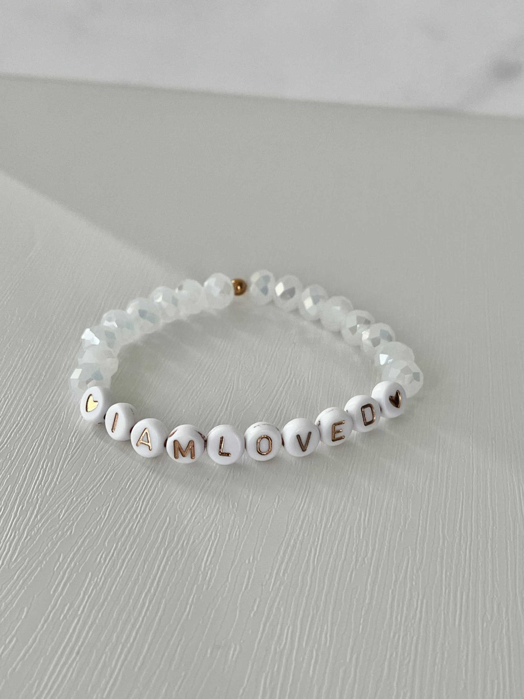 White beaded bracelet with crystal beads and 'I AM LOVED' letter beads