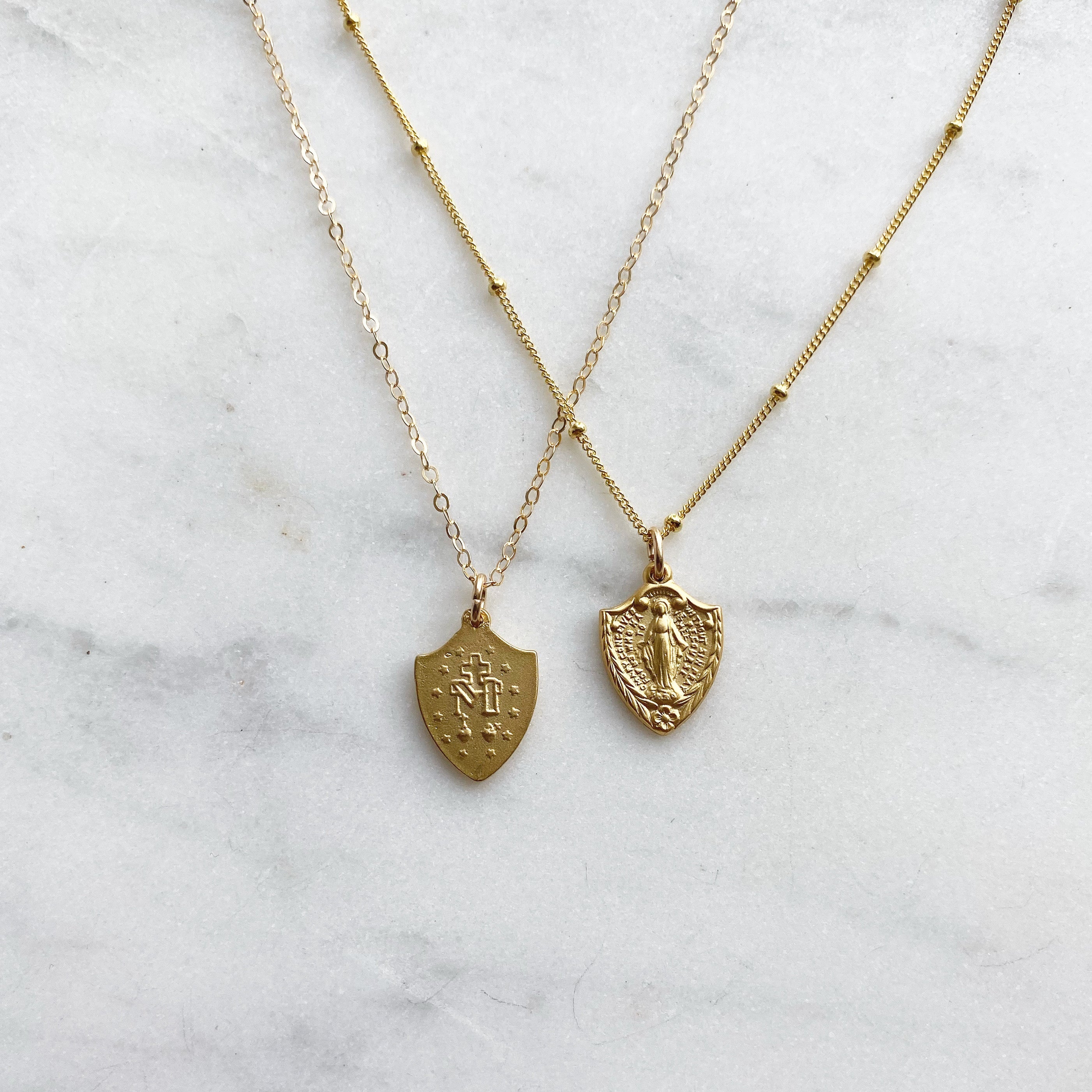 Gold-tone shield pendant necklaces with two shield designs, fine chain