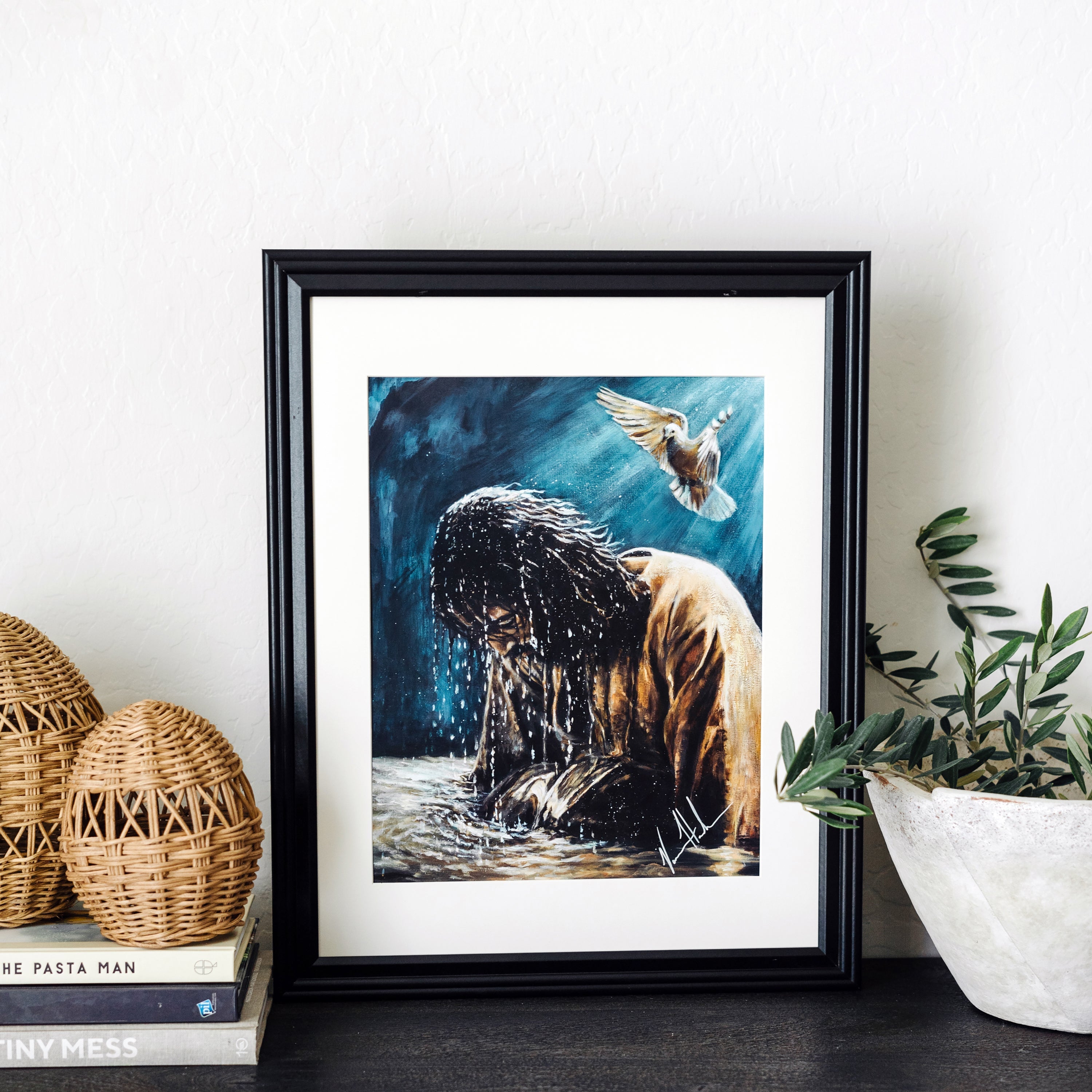 Black-framed animal art print with a dog in water and a bird flying above