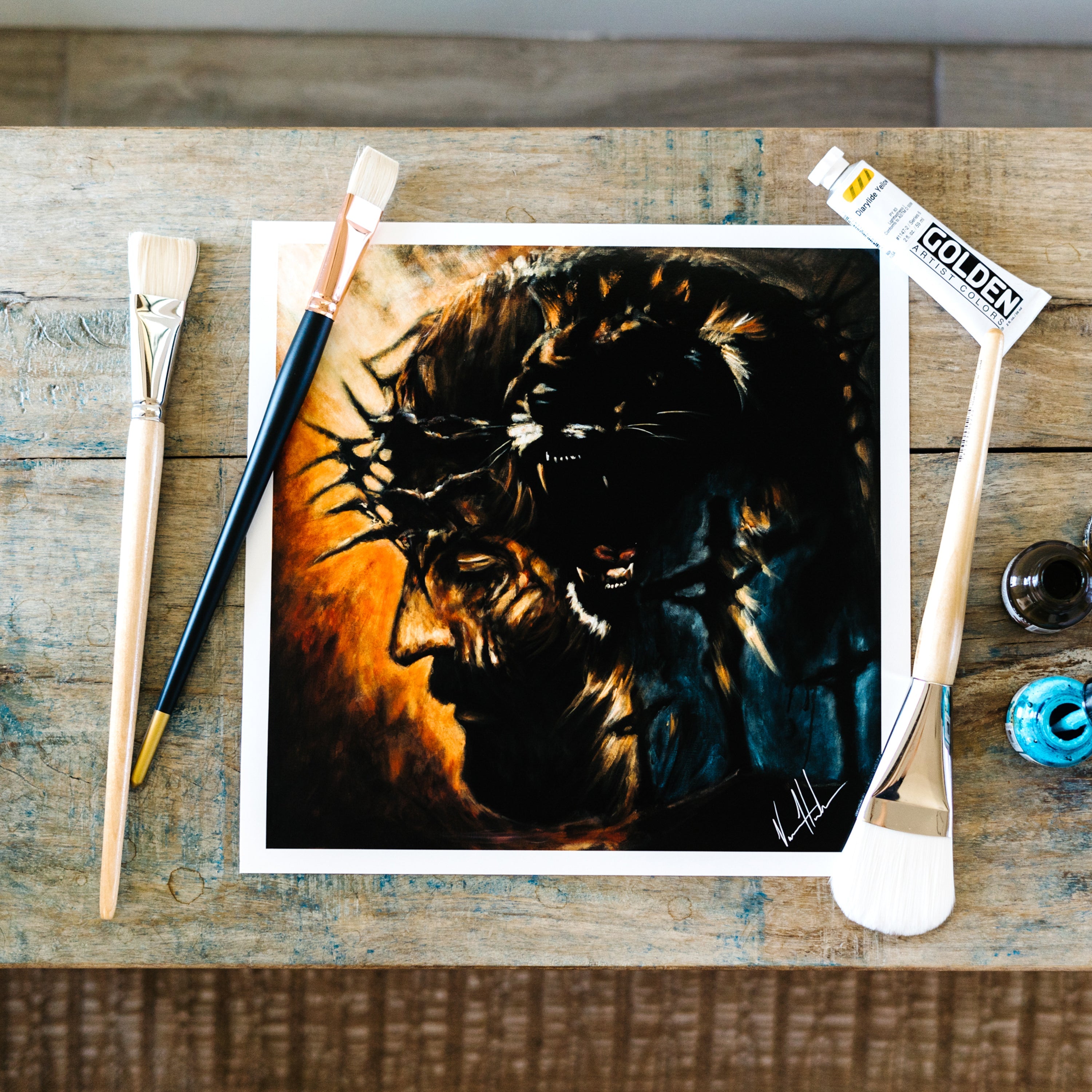 Square lion portrait art print with dark mane and warm orange lighting, white border