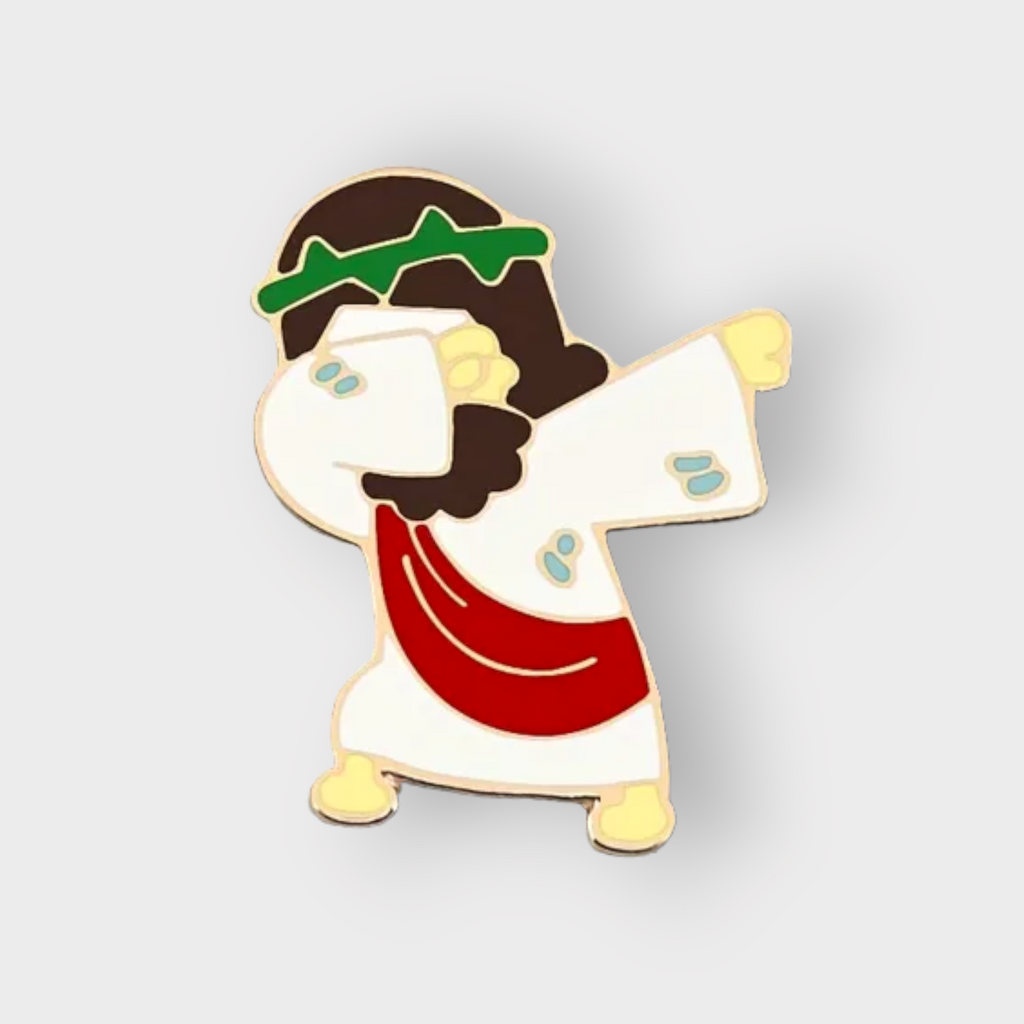 Cartoon enamel pin of Jesus dabbing, gold-tone with white, red, and green details