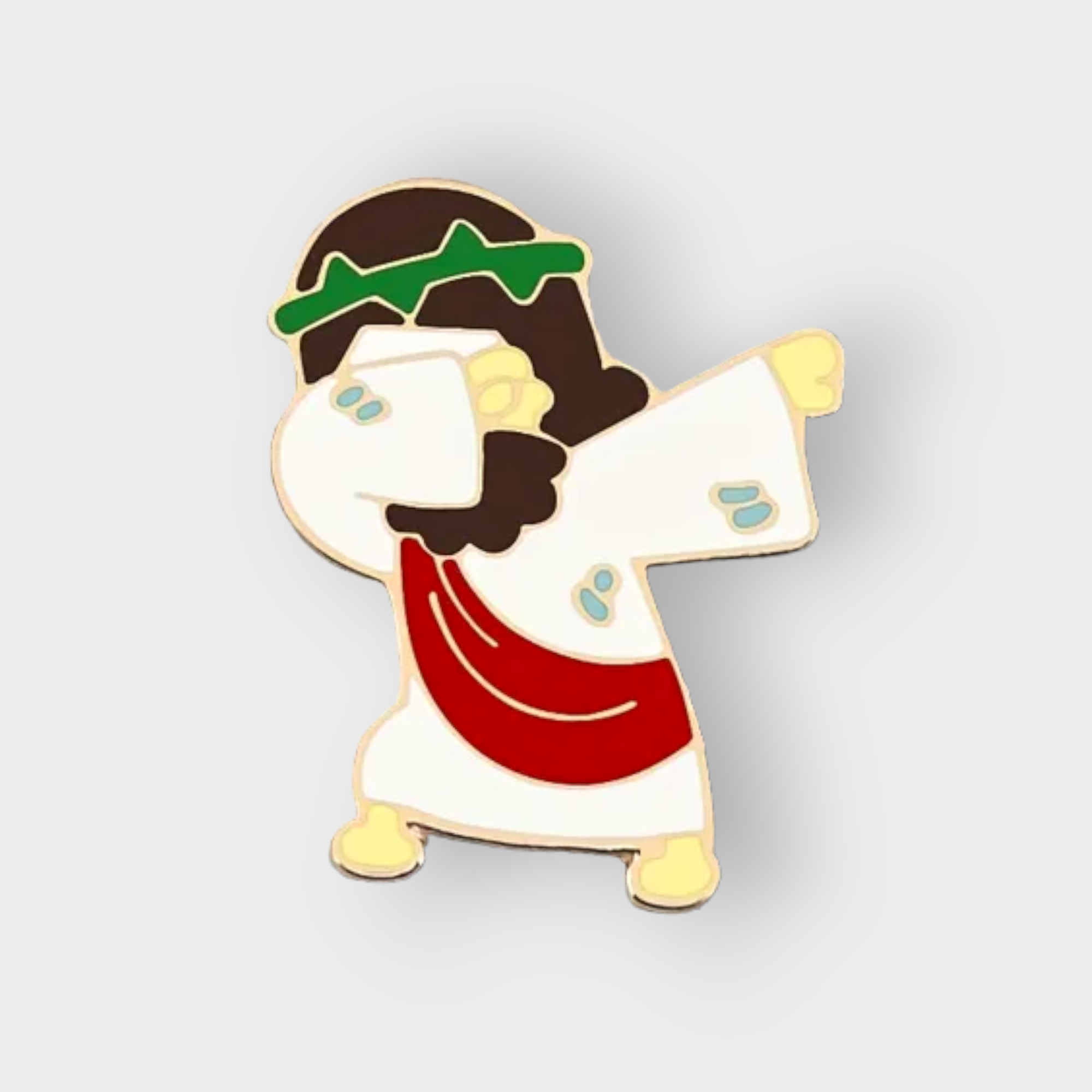 Cartoon enamel pin of Jesus dabbing, gold-tone with white, red, and green details