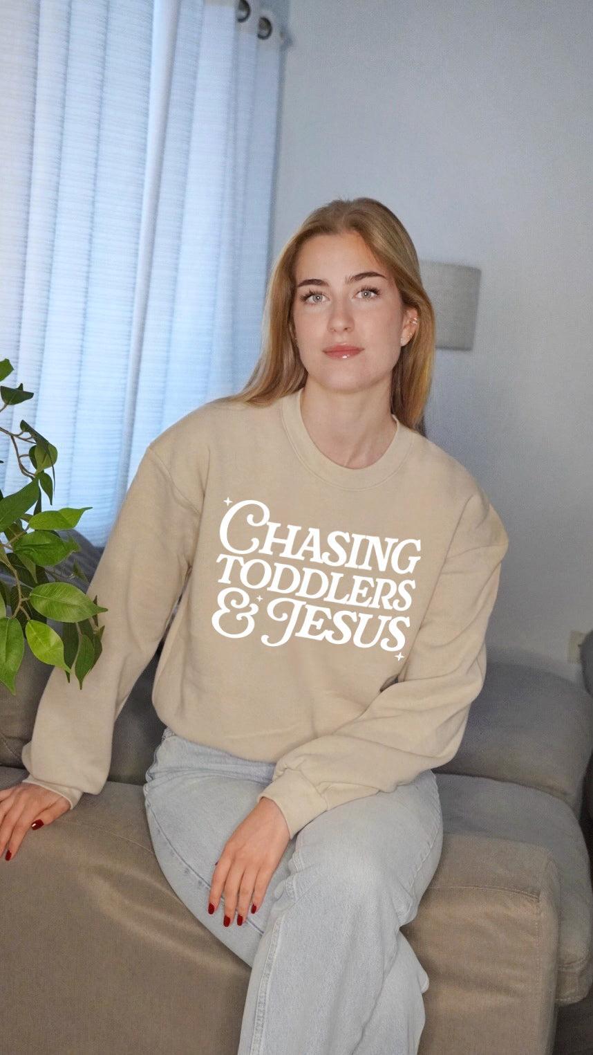 Women’s cropped sweatshirt in beige with Chasing Toddlers & Jesus front graphic