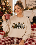 Light cream sweatshirt with front graphic of Christmas trees and stars