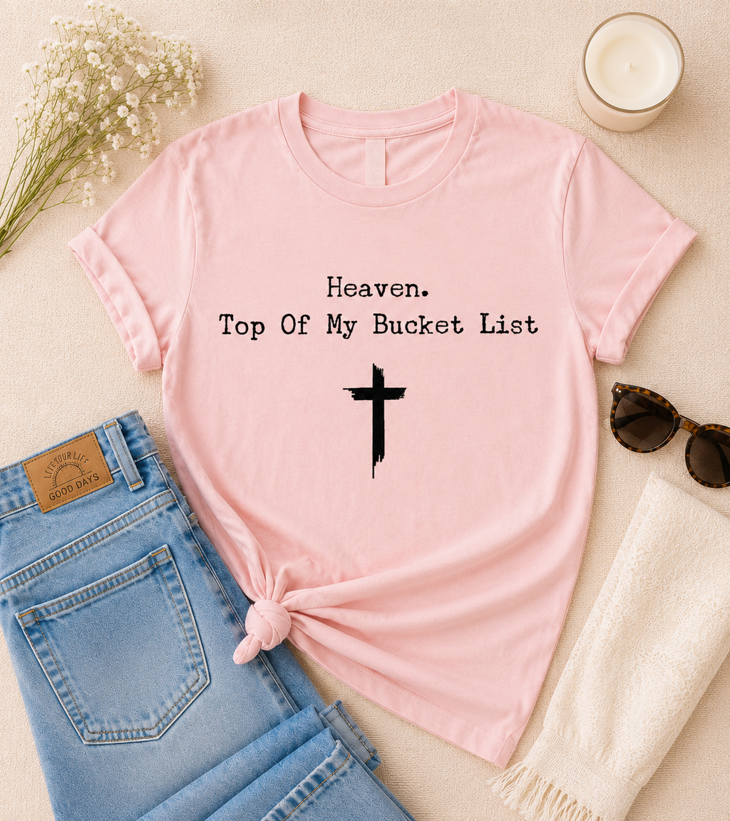 Pink short-sleeve tee with Heaven and Top Of My Bucket List text, plus cross