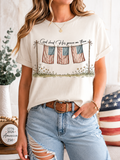 Women's white graphic T-shirt with faith text and flag-and-grass front print