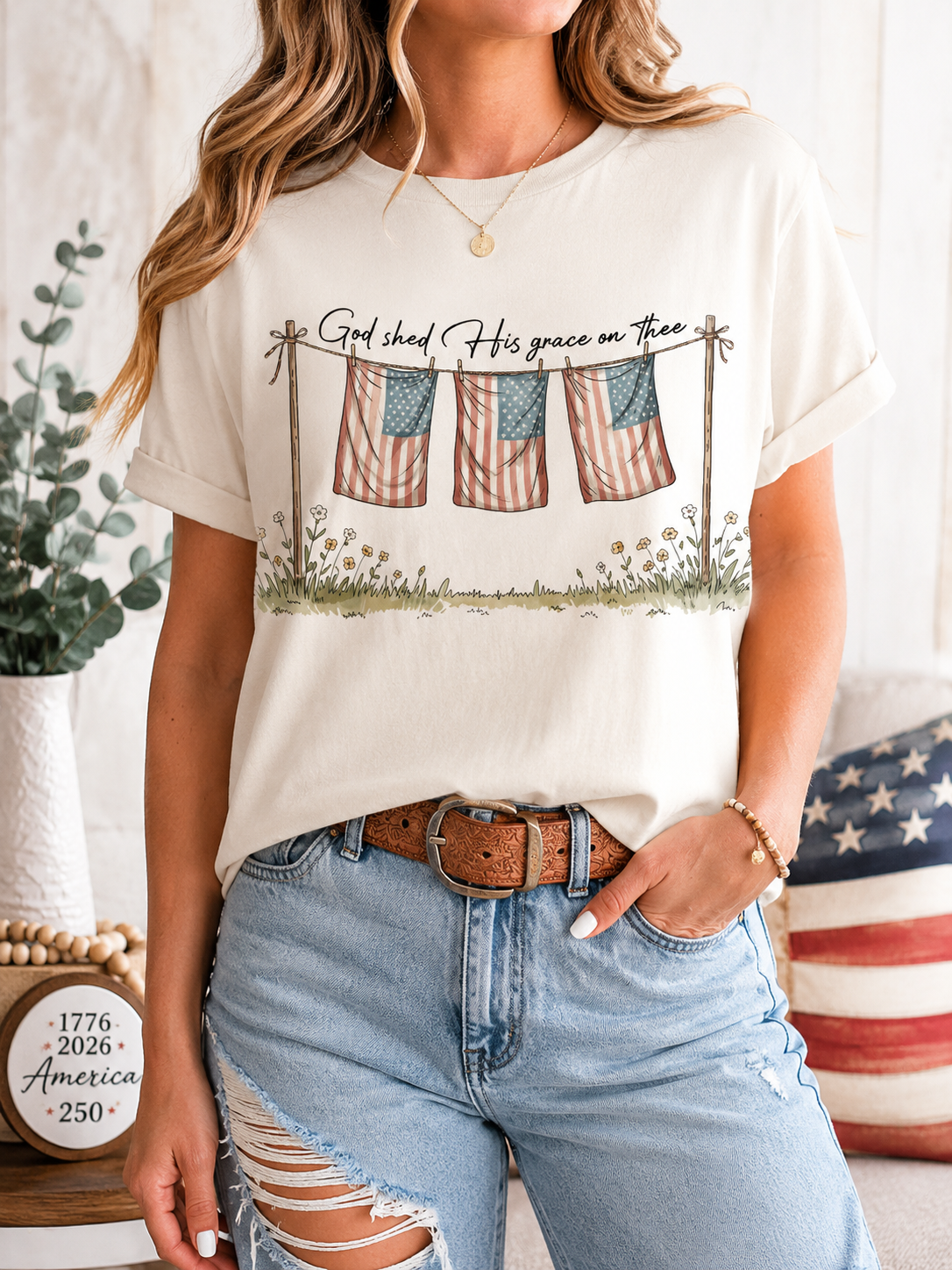 Women's white graphic T-shirt with faith text and flag-and-grass front print