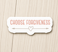 White sticker with orange “Choose Forgiveness” text and a heart between arrows