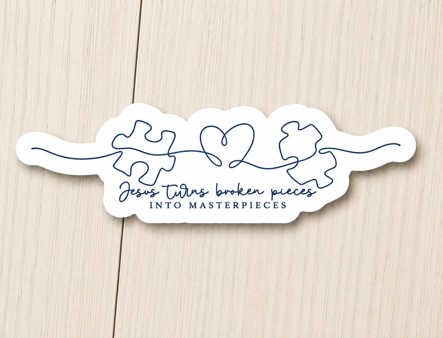White die-cut sticker with blue puzzle-piece graphic and script text