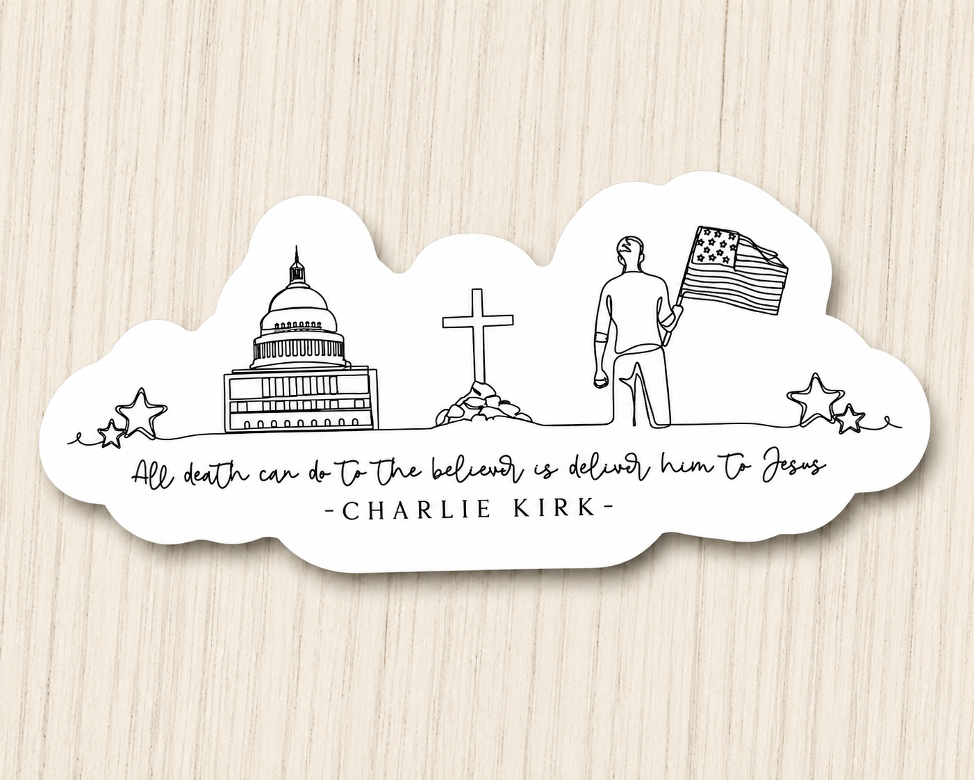 White sticker with black line art: capitol building, cross, flag, stars, slogan
