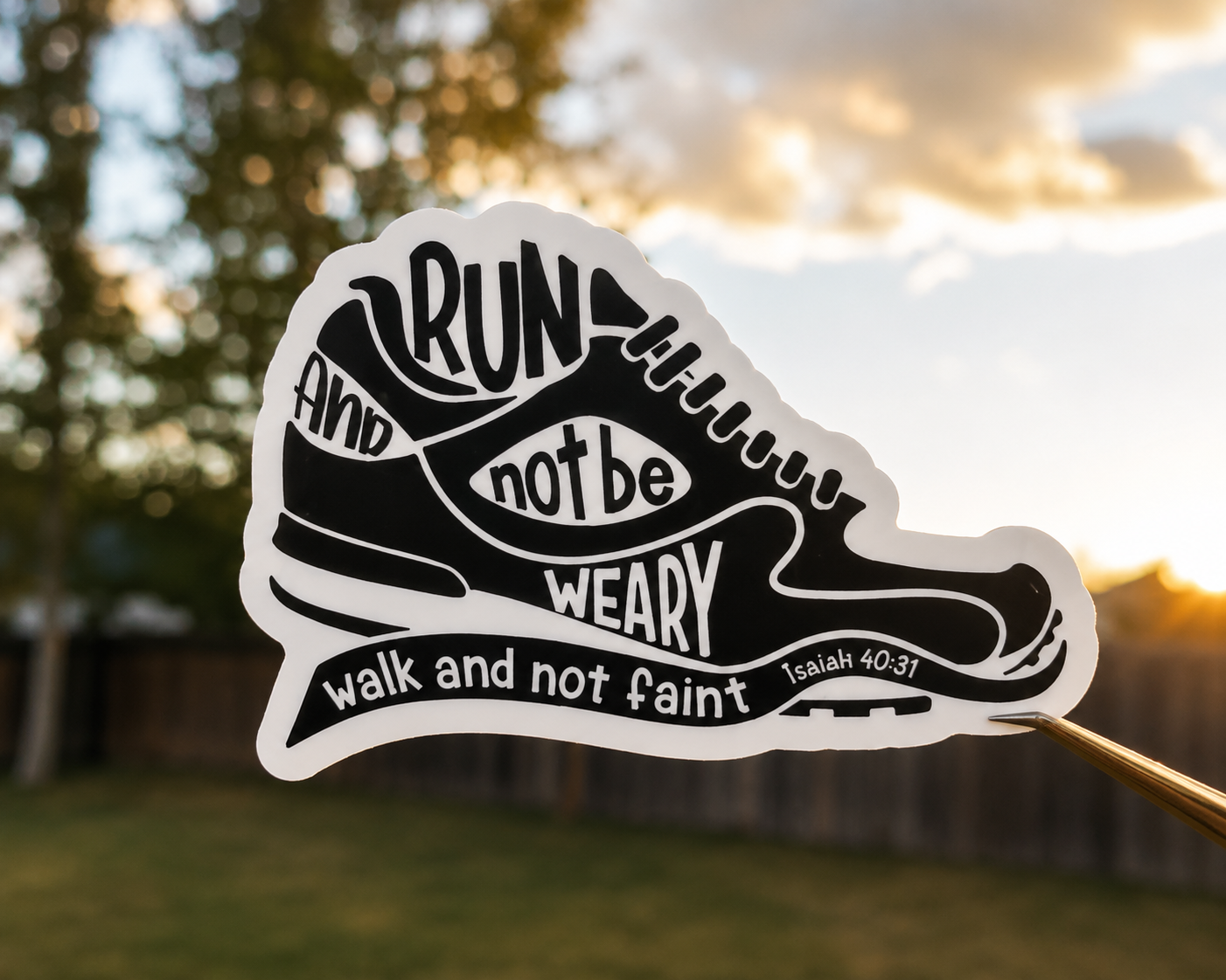White sneaker-shaped motivational sticker with 'Run and not be weary' text