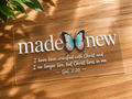 UV DTF decal with 'made new' text, turquoise butterfly, and verse on rectangle