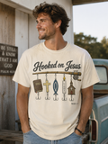 Cream T-shirt with “Hooked on Jesus” graphic and fishhook icons