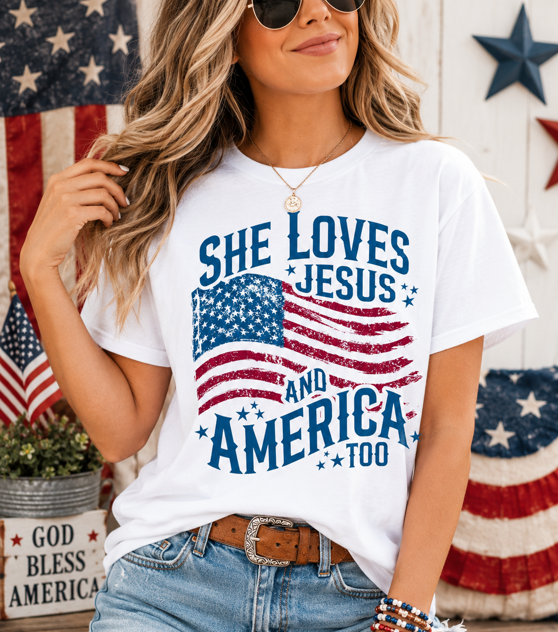 White graphic crewneck T-shirt with stars and text 'She Loves Jesus and America Too'