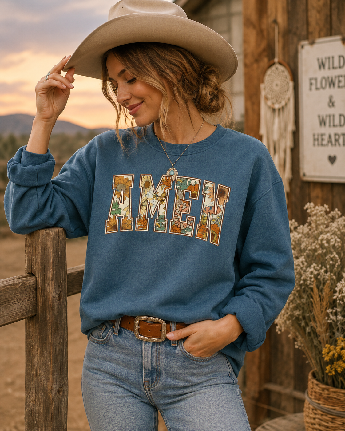 Denim blue crewneck sweatshirt with long sleeves and AMEN graphic on front