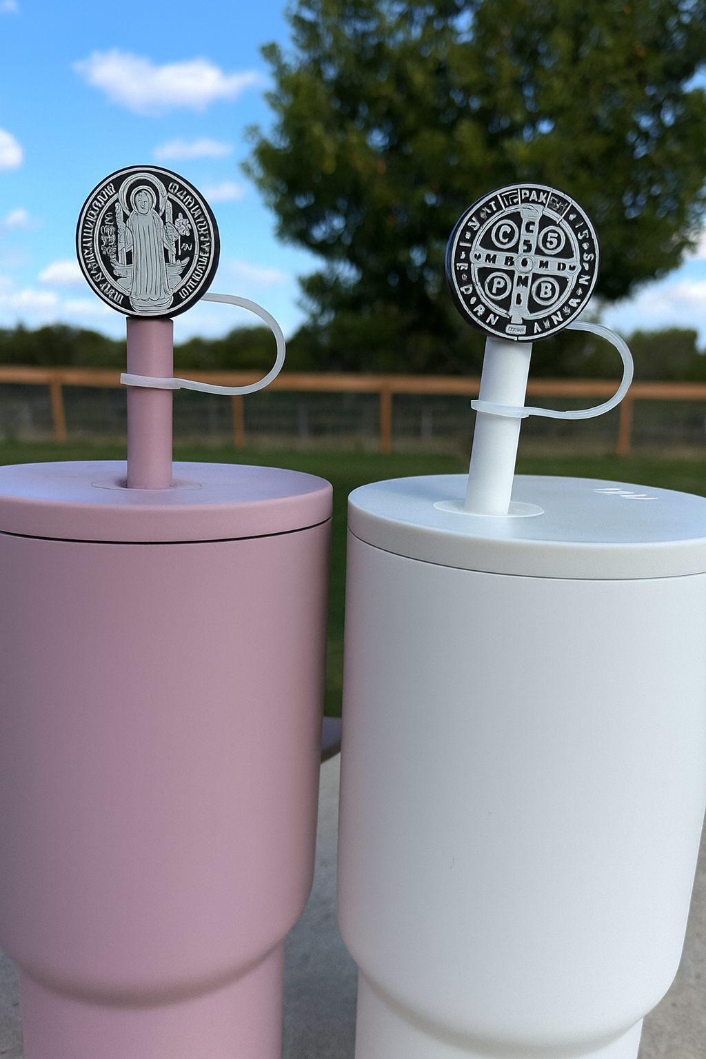 Two-pack straw topper with St. Benedict medal discs on white and purple bases