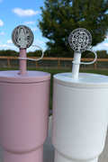 Two-pack straw topper with St. Benedict medal discs on white and purple bases