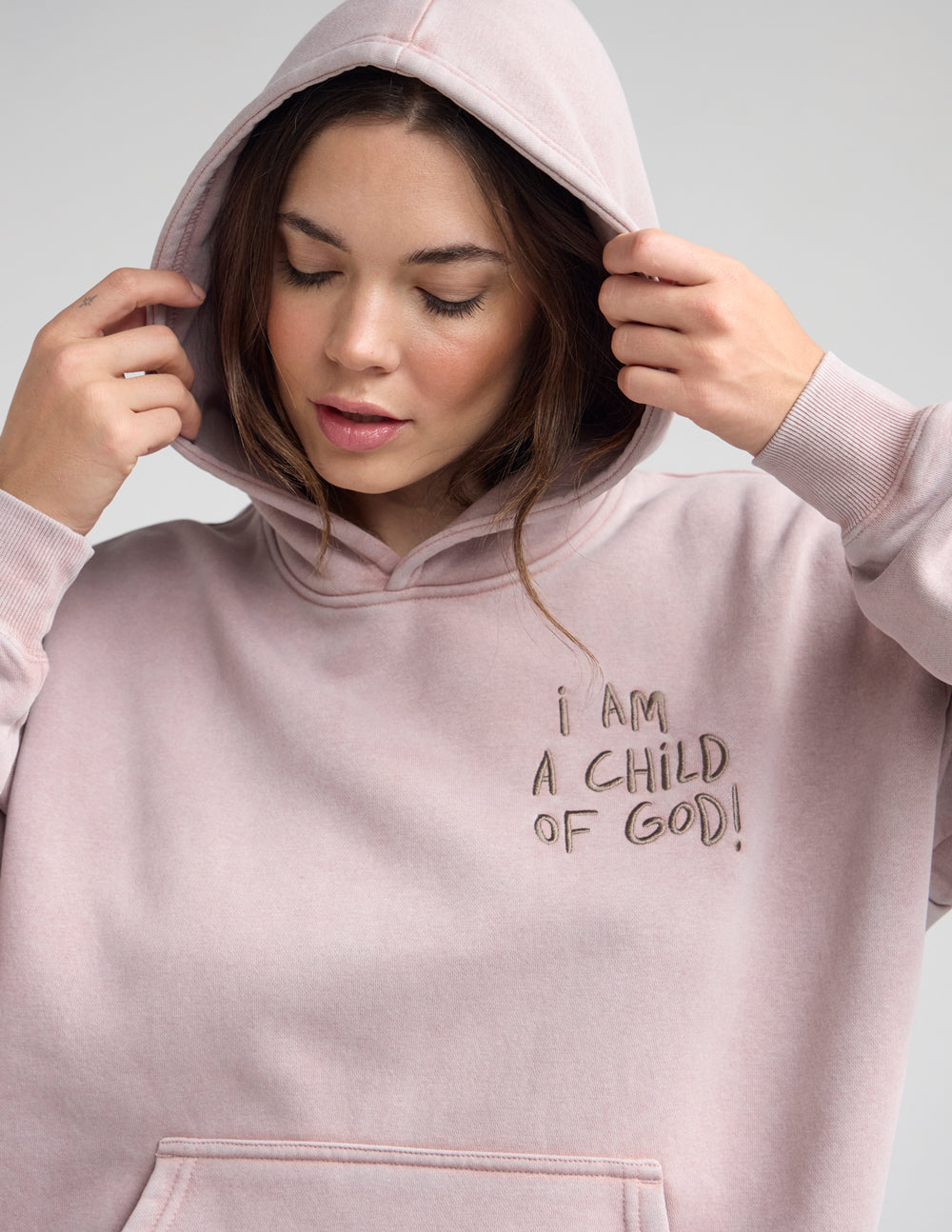 Mauve unisex hoodie with hood up and front graphic print