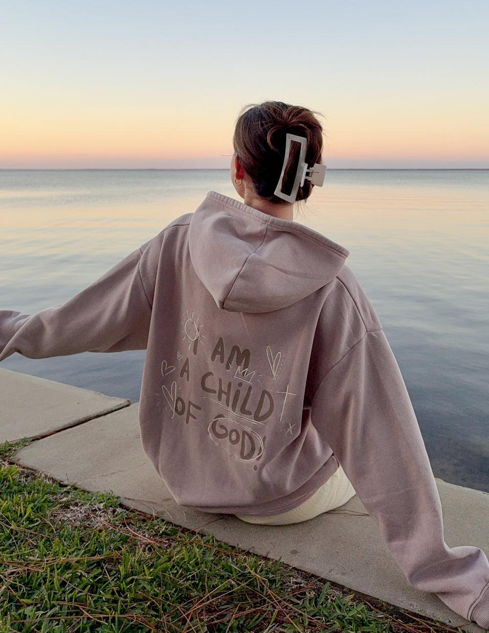 Mauve unisex hoodie with rear graphic print and adjustable hood