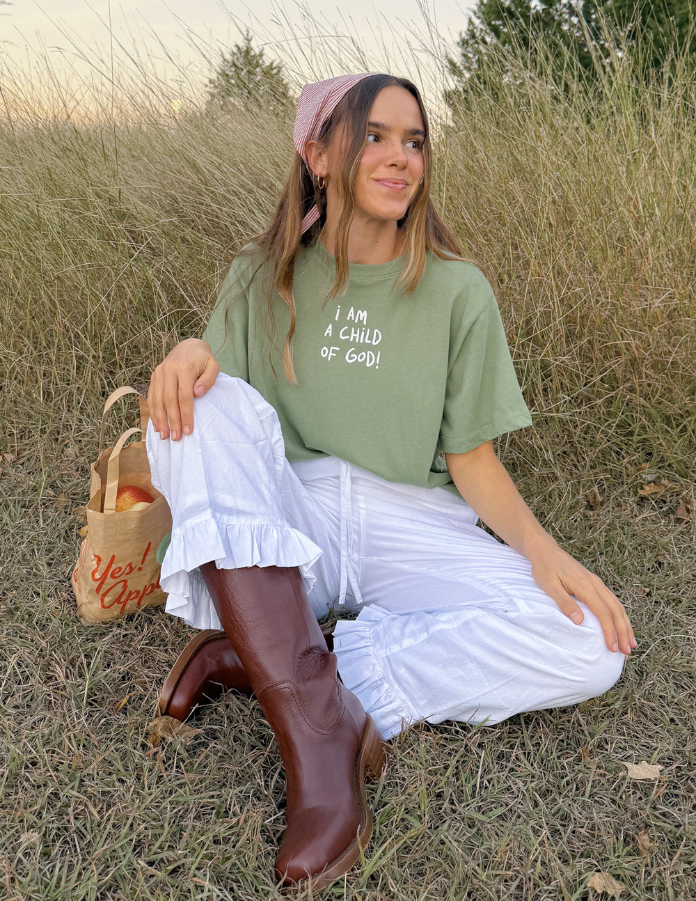 Green cropped women’s tee with short sleeves and “I AM A CHILD OF GOD!” front text