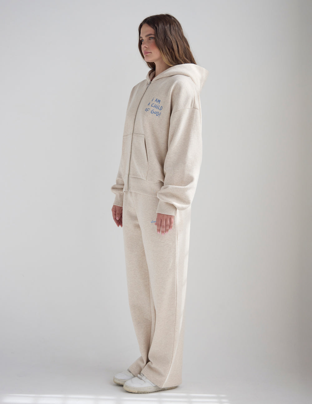 Eggshell full-zip hoodie with side view and front pocket seams