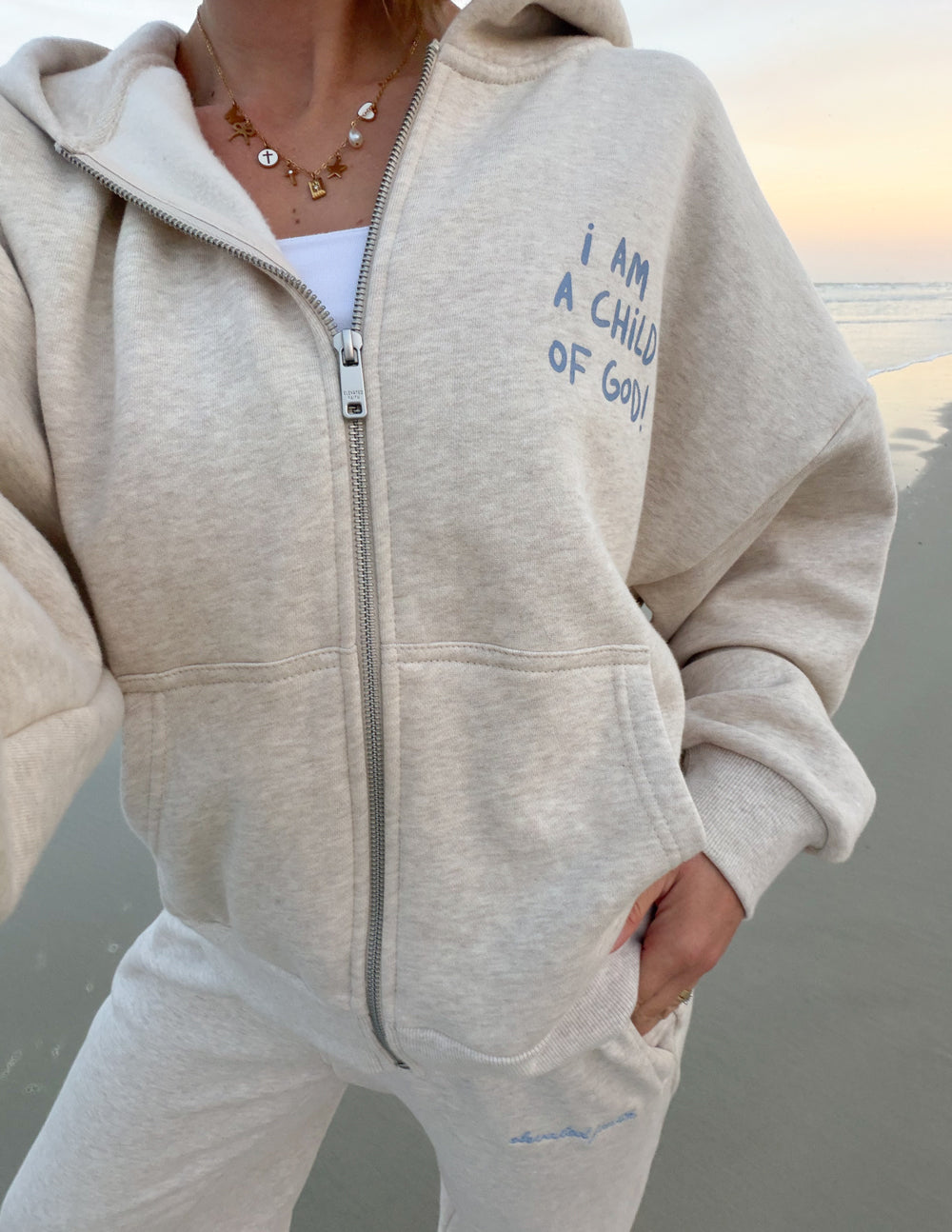 Eggshell full-zip hoodie with front zipper and chest logo print