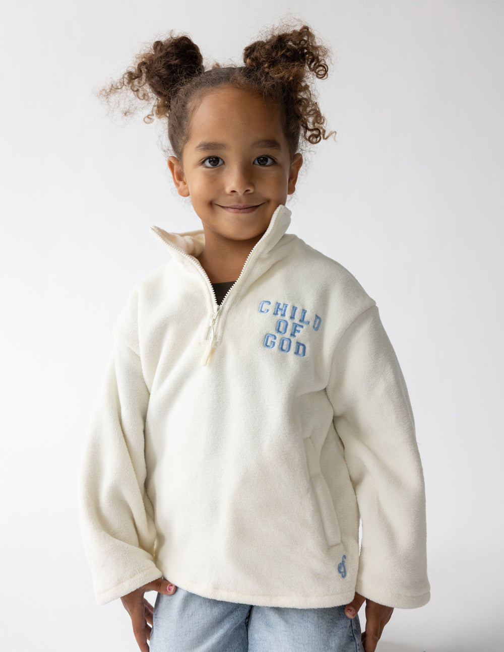 Kids cream fleece pullover with half-zip and multicolor “CHILD OF GOD” logo