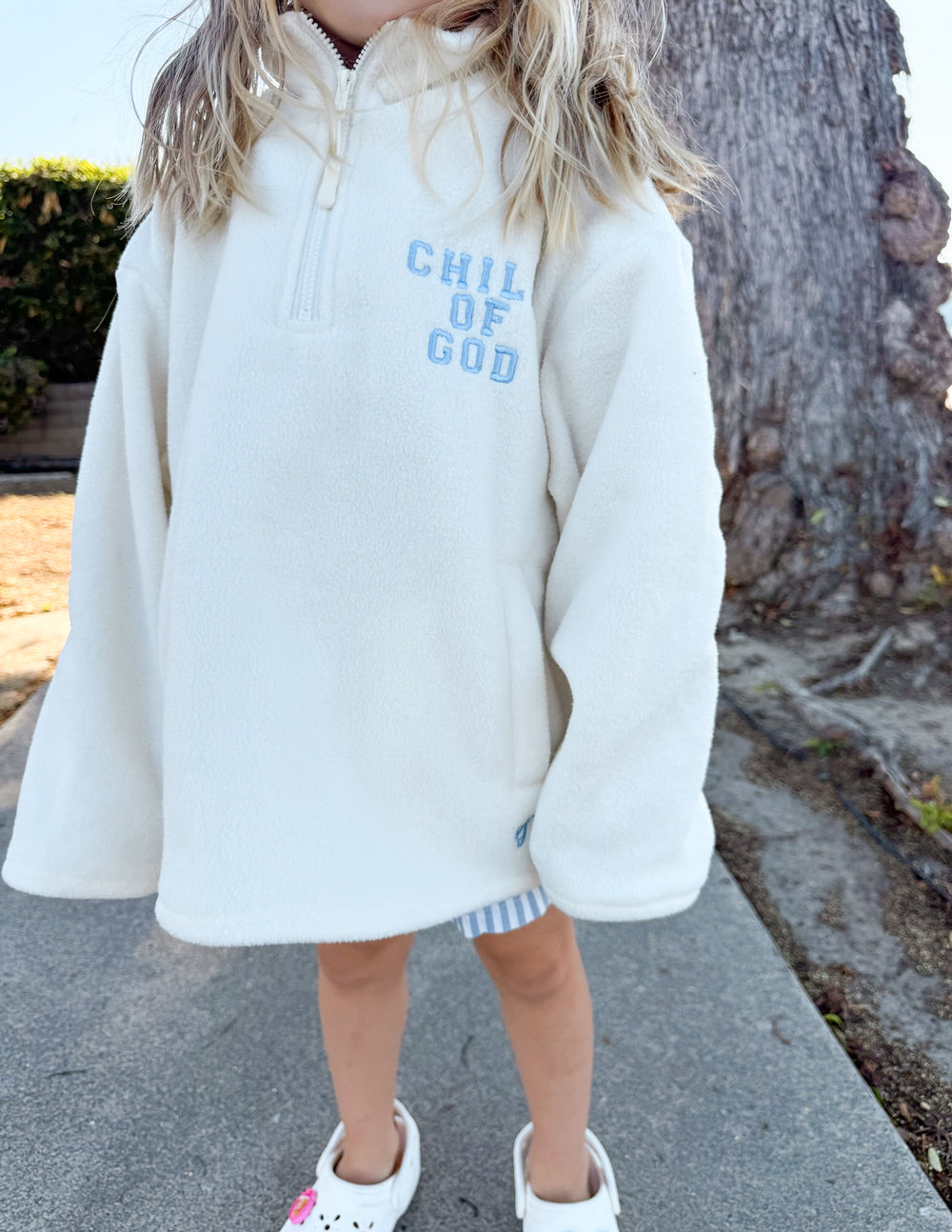 Kids cream fleece pullover with half-zip and multicolor “CHILD OF GOD” logo