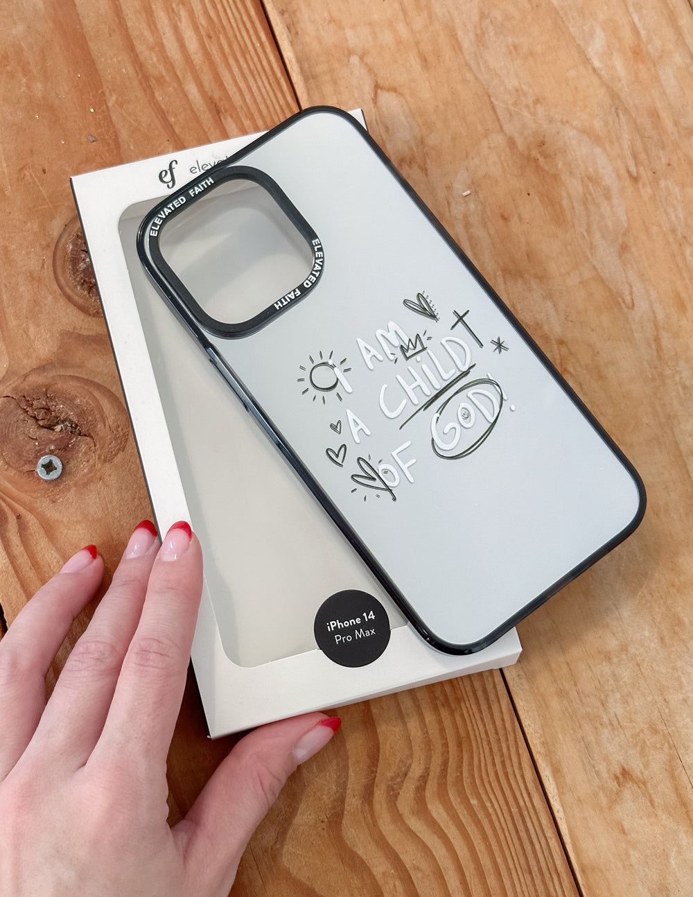 Mirror phone case with black frame, camera cutout, and "I AM CHILD OF GOD" design