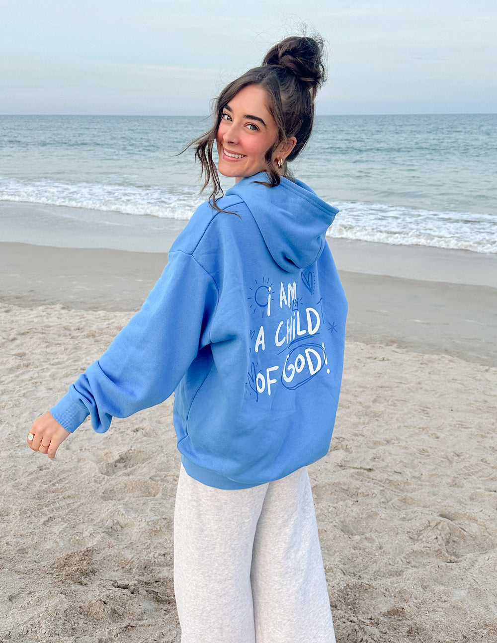 Light blue unisex hoodie with chest print and kangaroo pocket