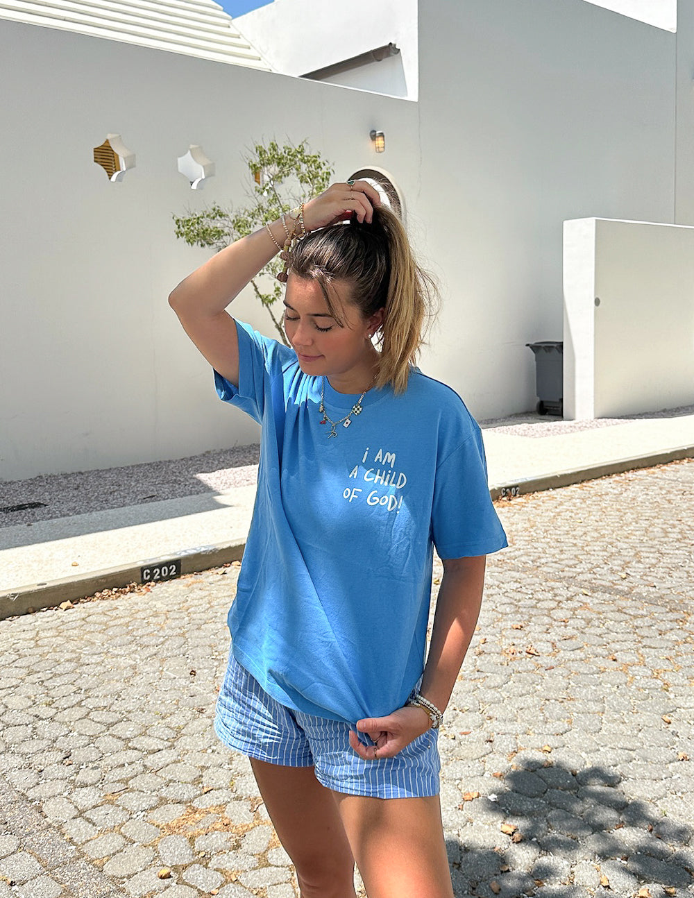 Blue unisex T-shirt with front “I AM A CHILD OF GOD!” text