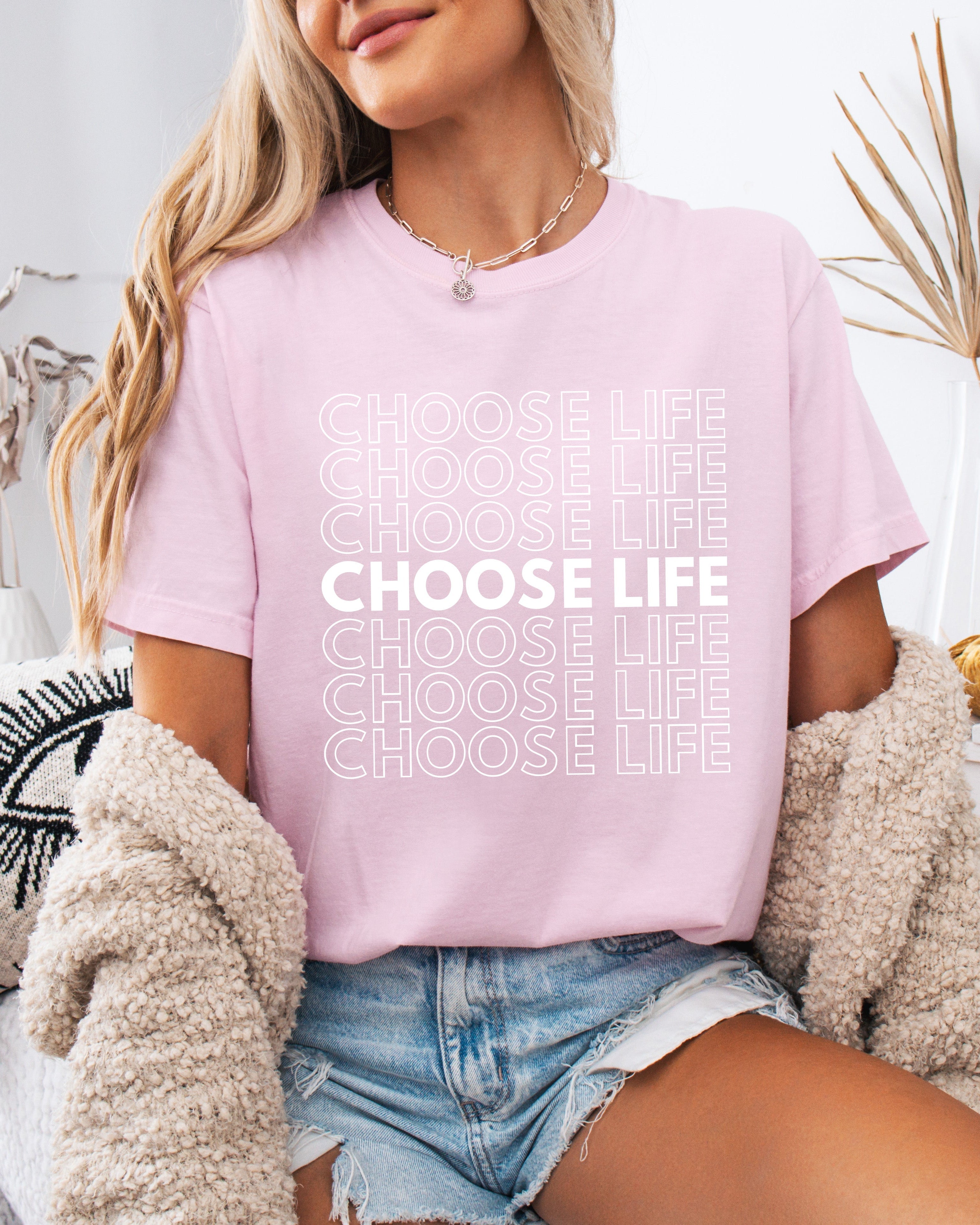 Dusty pink Christian t-shirt with “CHOOSE LIFE” text graphic on the front.
