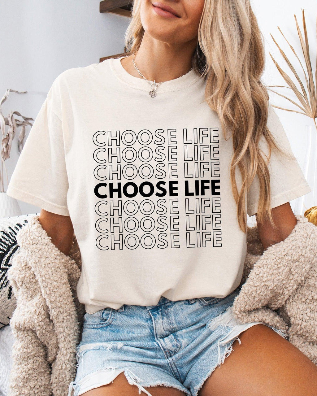 Ivory Christian t-shirt with “CHOOSE LIFE” text graphic on the front.