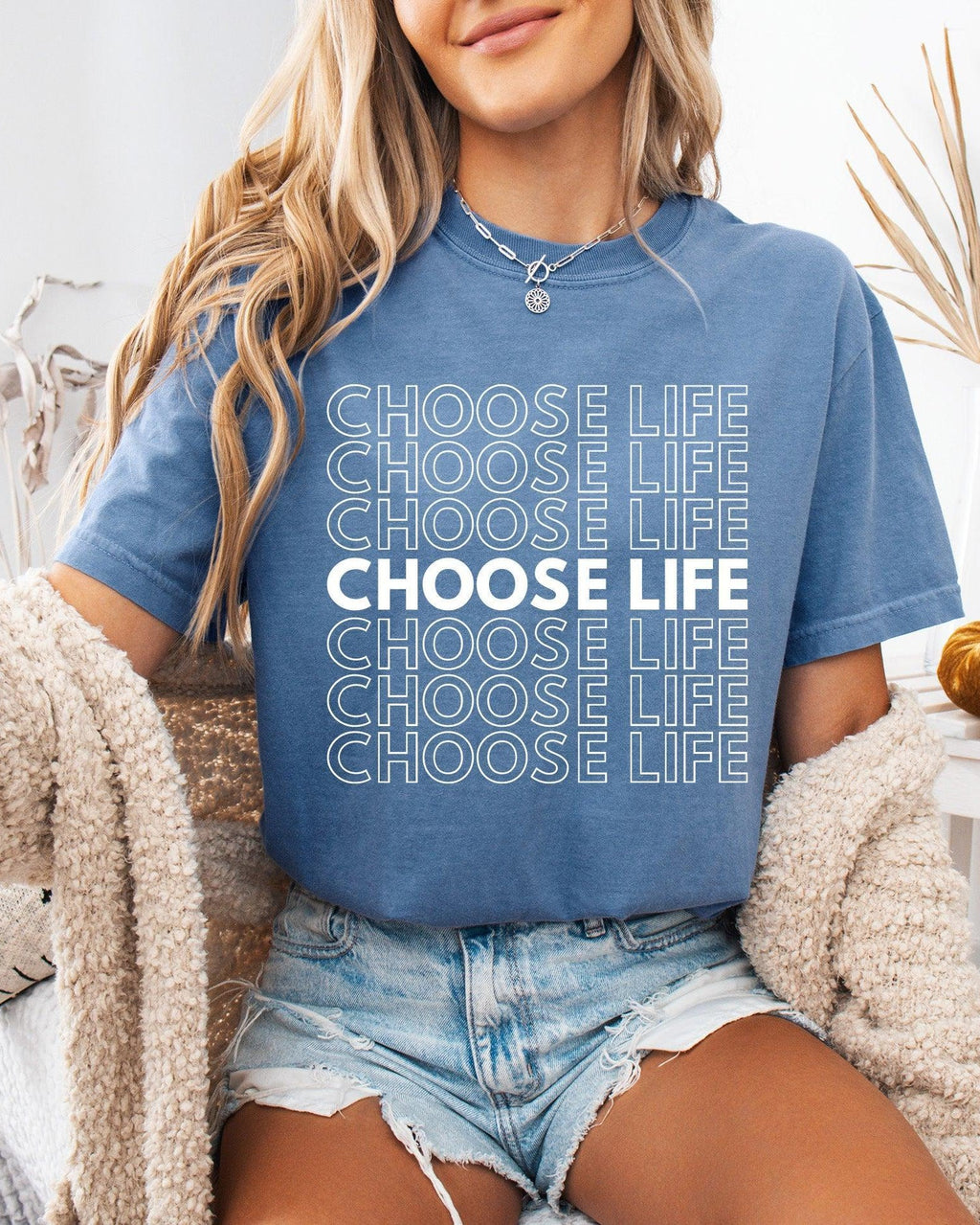 Blue Christian t-shirt with “CHOOSE LIFE” text graphic on the front.