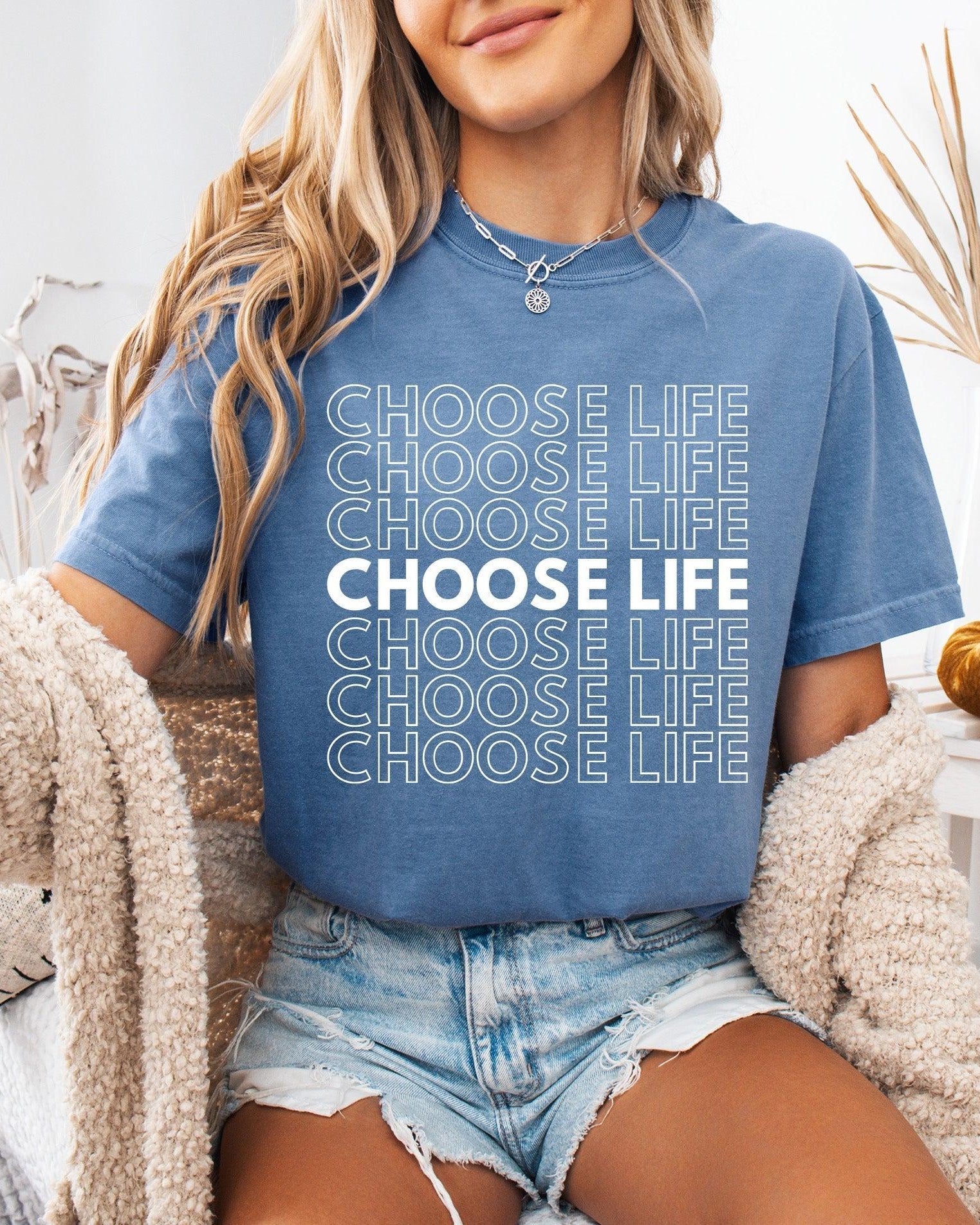 Blue Christian t-shirt with “CHOOSE LIFE” text graphic on the front.