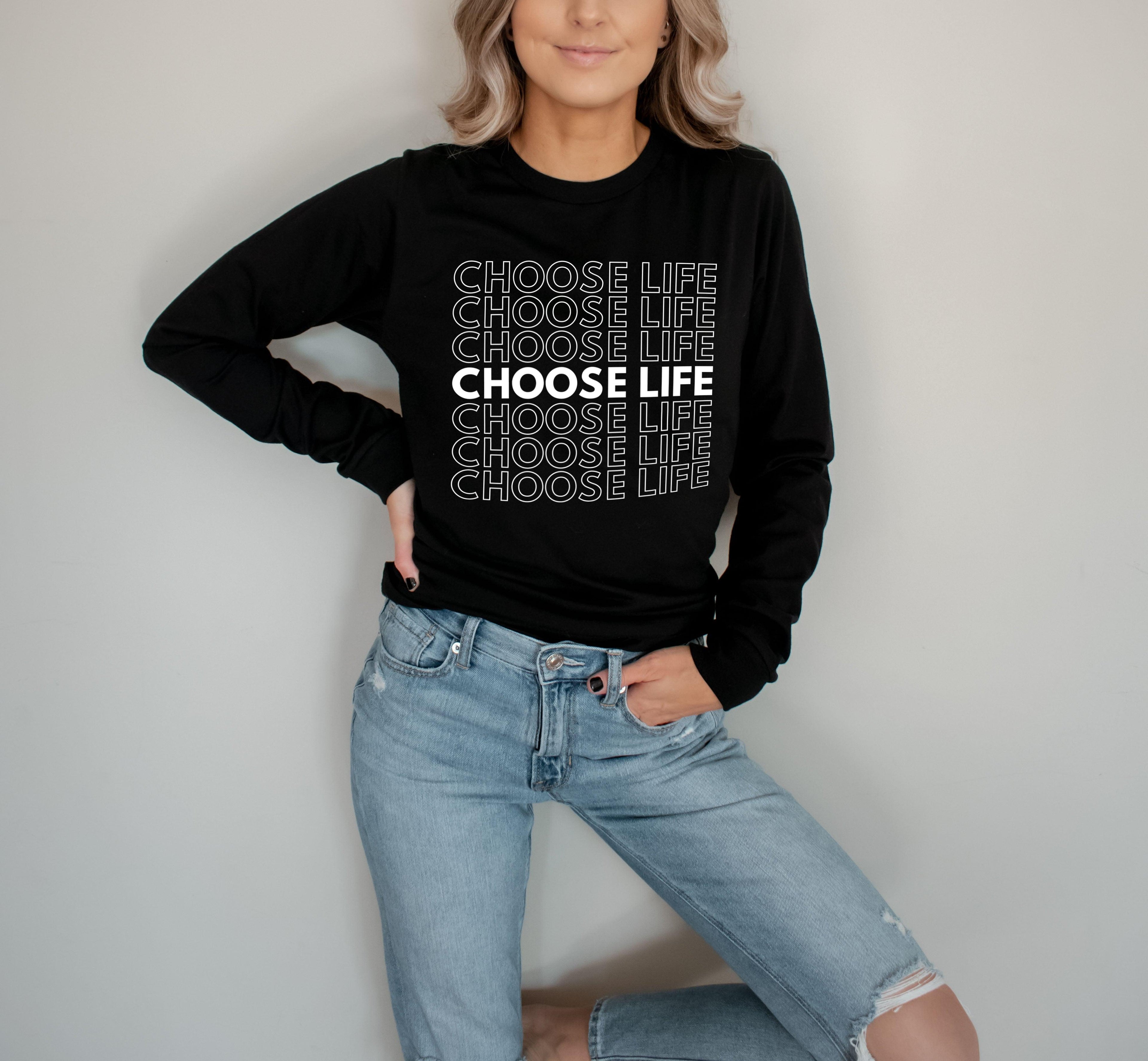 Long-sleeve T-shirt, black with repeated slogan print, model wearing