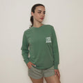 Green long sleeve pocket tee with "LOVE LIKE JESUS" chest print