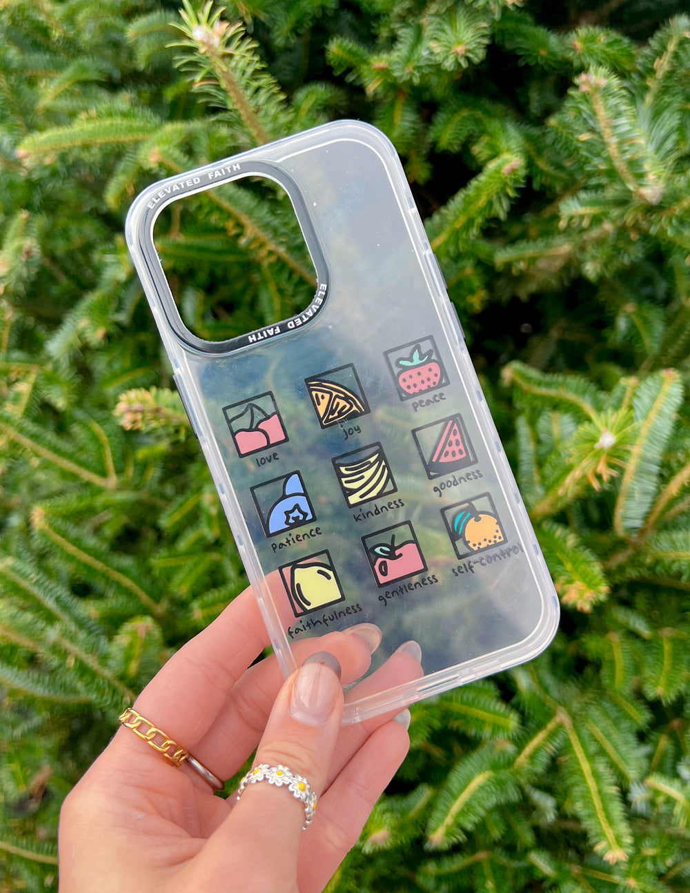 Clear phone case with fruit-themed icon strip on the back