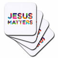 Square coasters showing colorful "JESUS MATTERS" typographic design on white