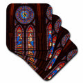 Stained-glass coasters featuring detailed church window artwork in blue and red