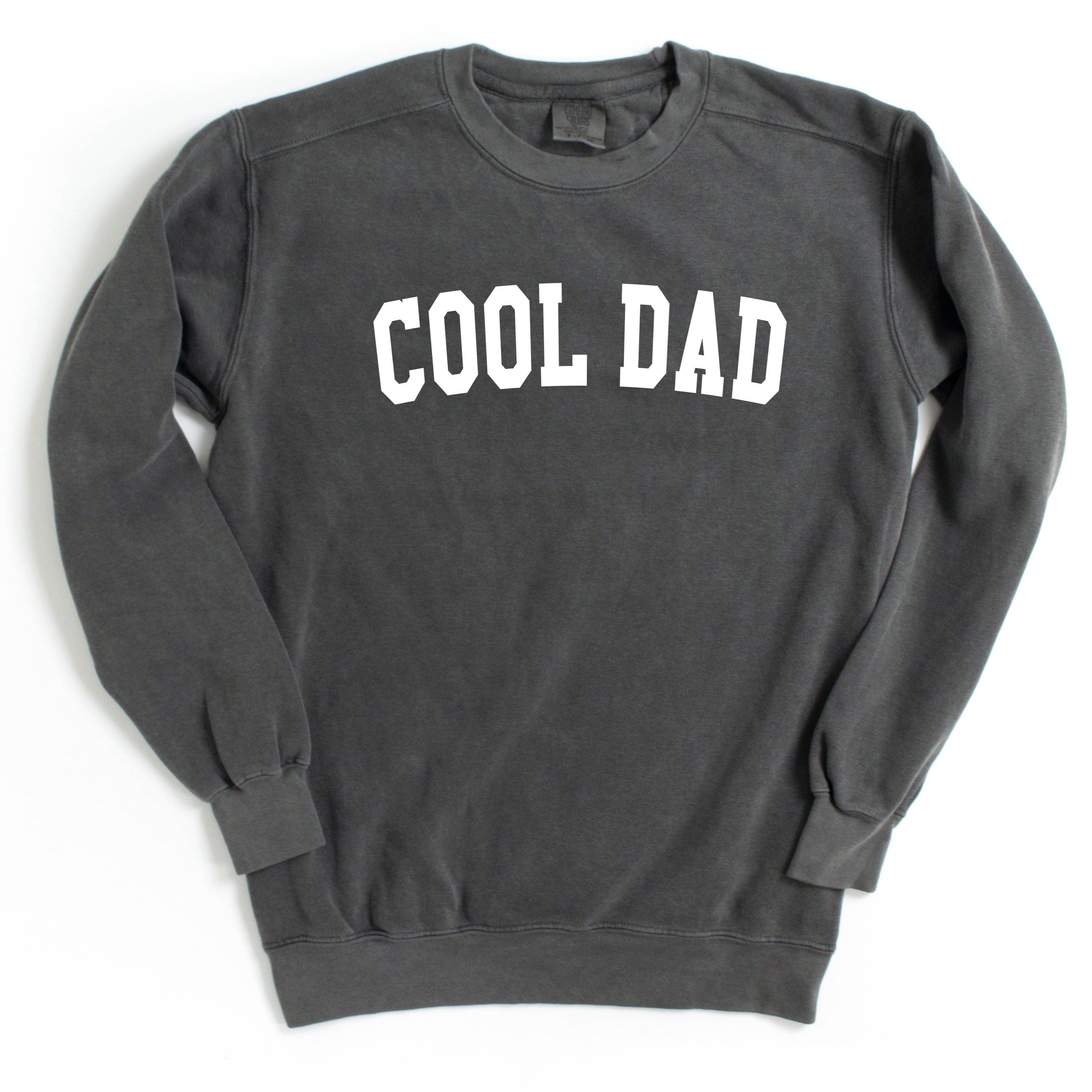 Dark gray crewneck sweatshirt with white “COOL DAD” print