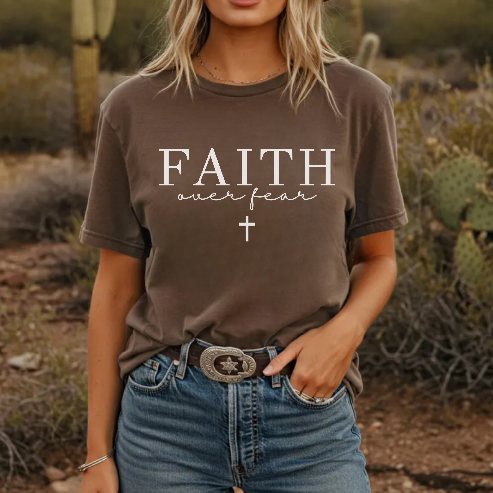 Dark brown graphic T-shirt with white “FAITH” over “fear” and cross