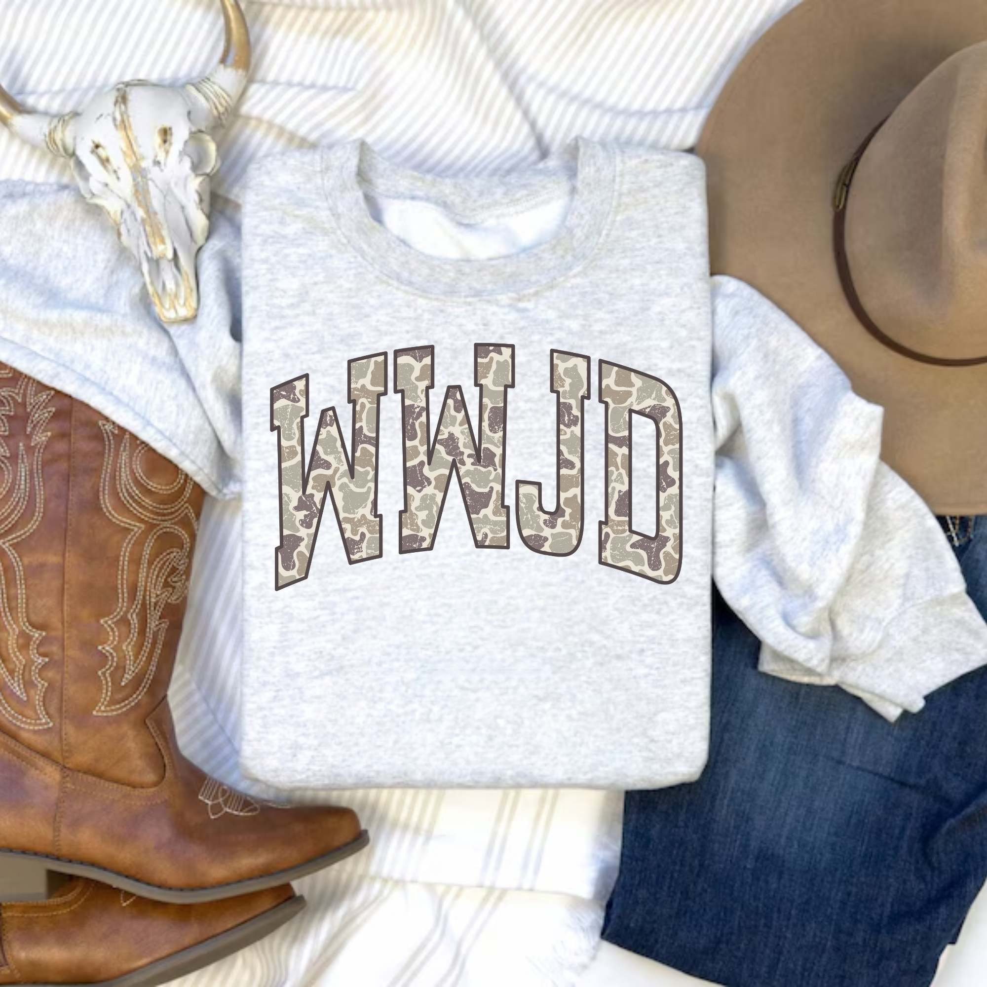 Gray crewneck sweatshirt with camo-style WWJD graphic, folded view