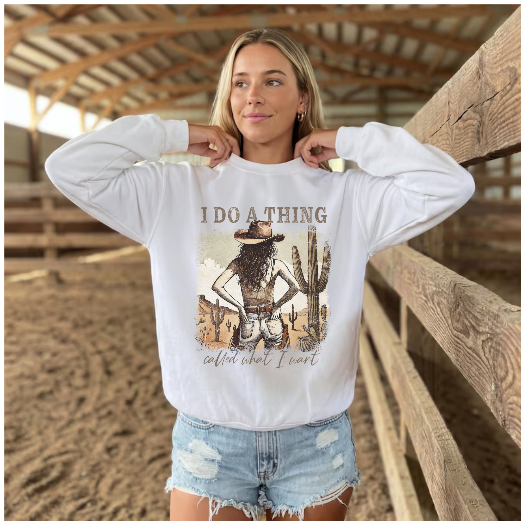 White cowgirl sweatshirt with front graphic text "I do a thing"