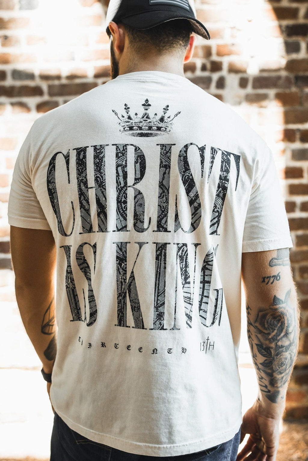 Ivory premium tee with large back graphic text and crown