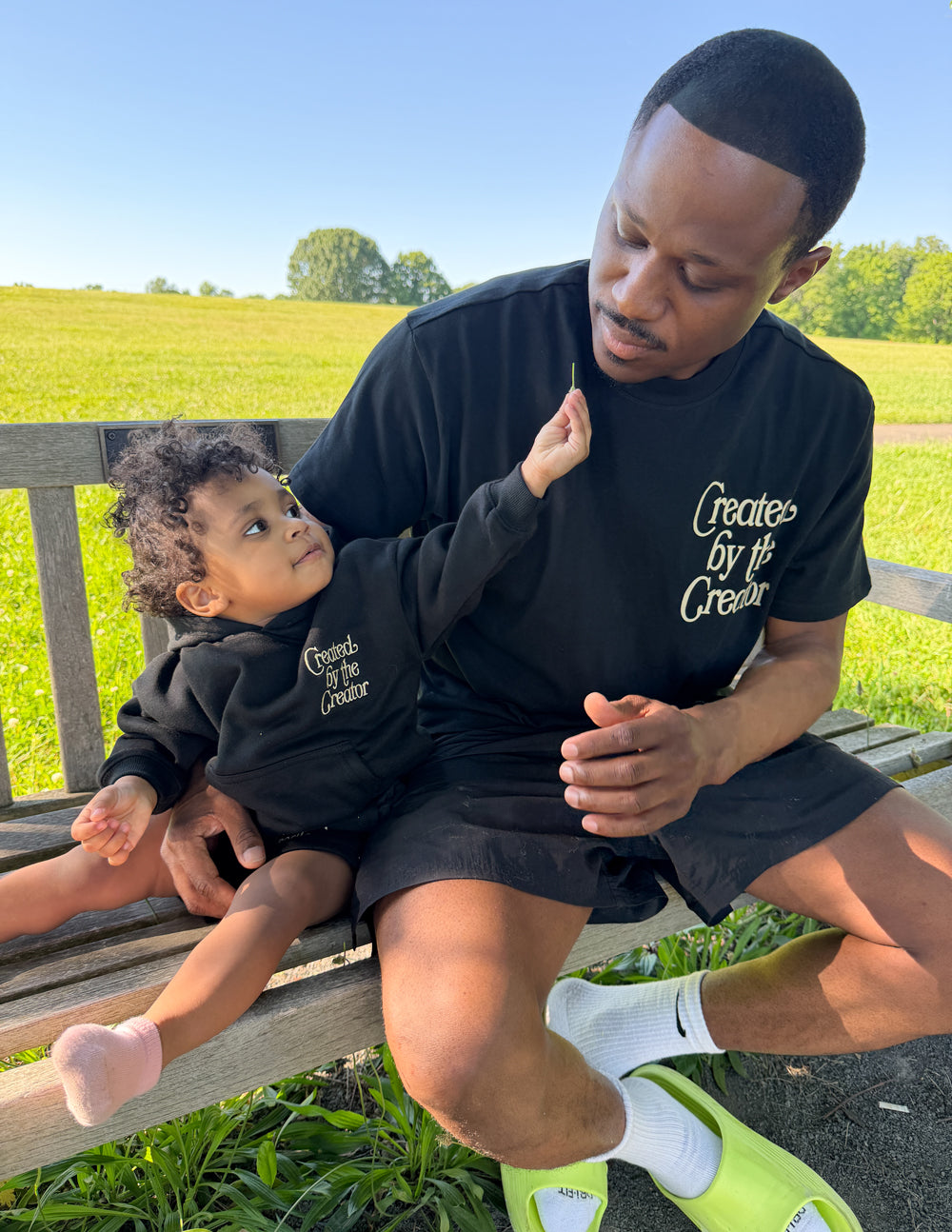 Kids black hoodie with front “Created by the Creator” logo